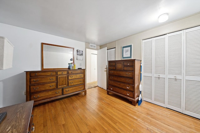 bedroom featuring a closet and light hardwood / wood-style flooring