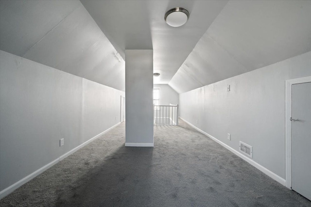 additional living space with lofted ceiling and carpet