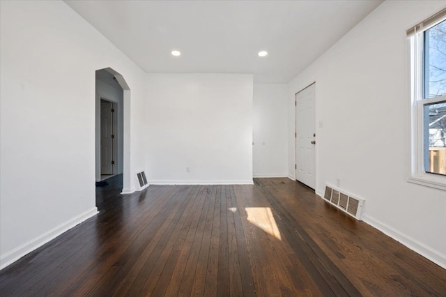 spare room featuring dark hardwood / wood-style floors