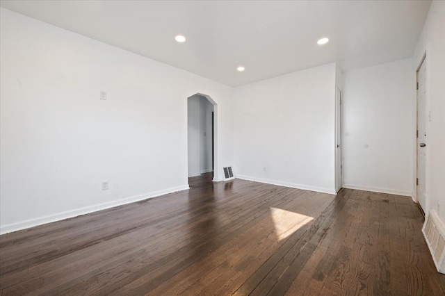 empty room featuring dark hardwood / wood-style floors