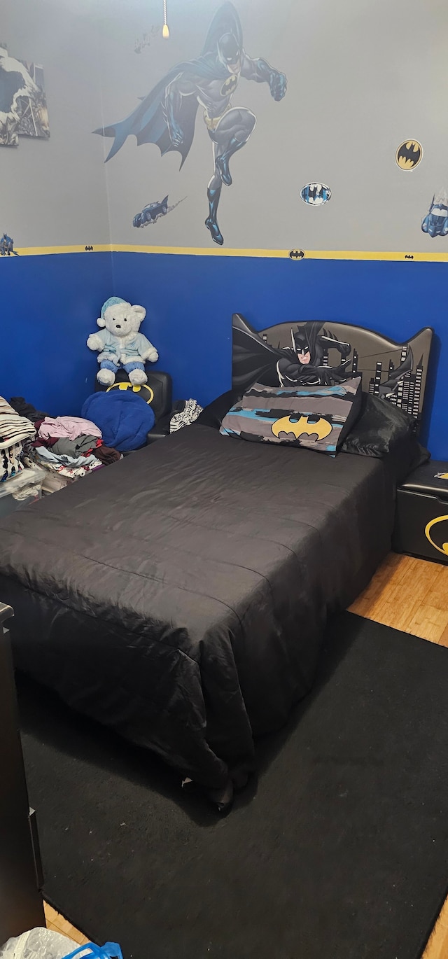 bedroom featuring wood-type flooring