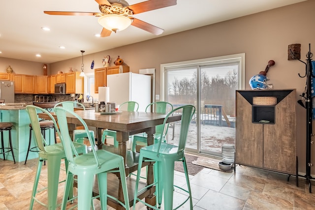 dining room with ceiling fan and a healthy amount of sunlight