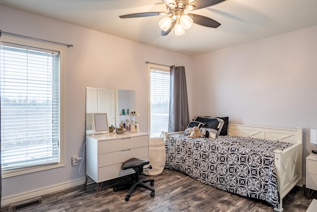 bedroom featuring dark wood-type flooring and ceiling fan