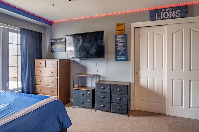 bedroom with a closet and carpet flooring