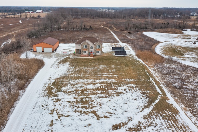 snowy aerial view featuring a rural view