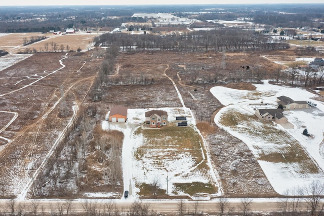 snowy aerial view featuring a rural view