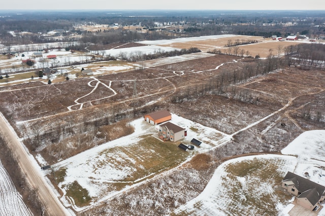 snowy aerial view with a rural view