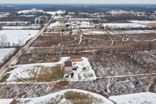 snowy aerial view featuring a rural view