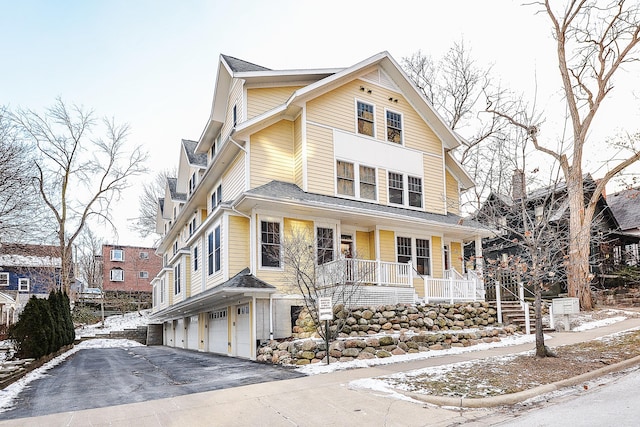 front of property with a garage and covered porch