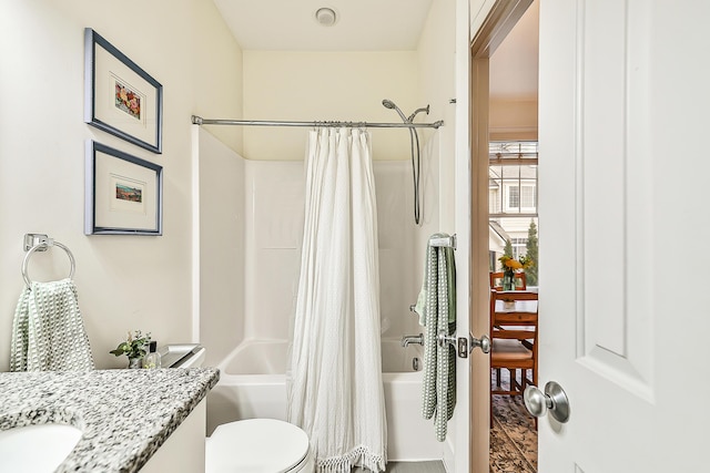 full bathroom featuring shower / tub combo with curtain, vanity, and toilet