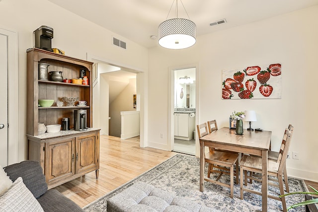 dining room with light hardwood / wood-style floors