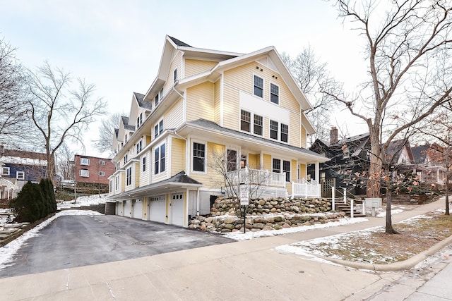 view of front of property featuring a garage and a porch