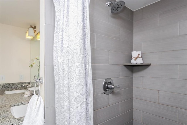 bathroom featuring vanity and a shower with shower curtain