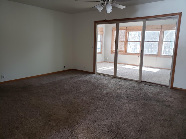 unfurnished room with ceiling fan, a healthy amount of sunlight, and carpet