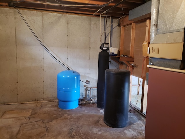 utility room featuring heating unit