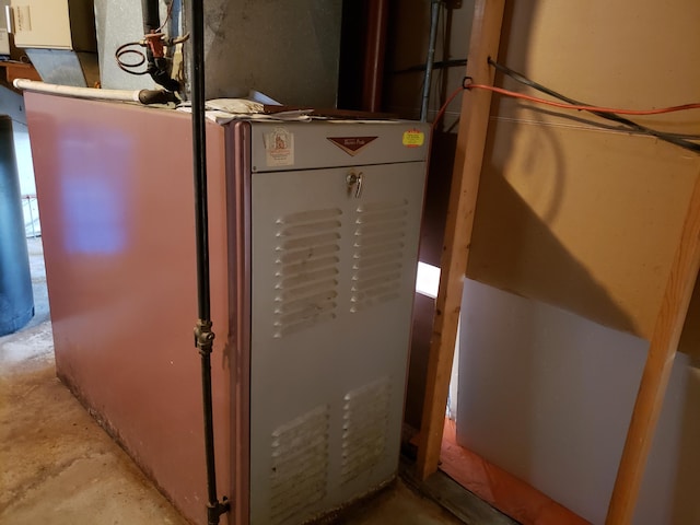 utility room with heating unit