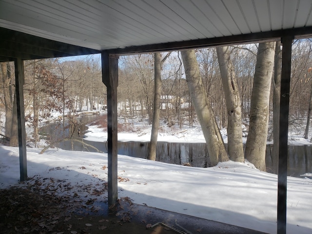 view of yard layered in snow