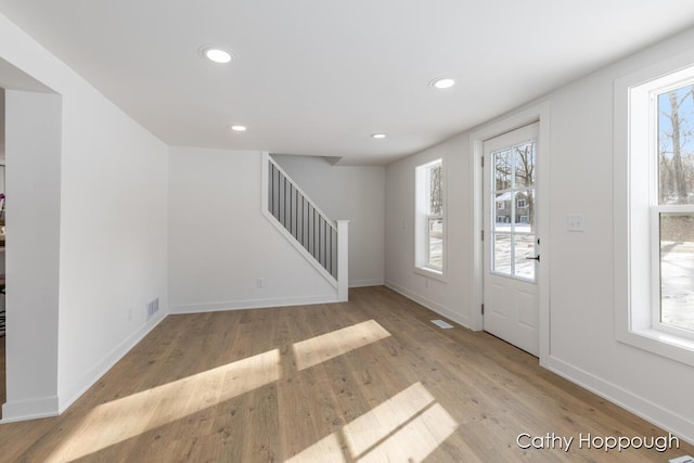 foyer with light hardwood / wood-style floors