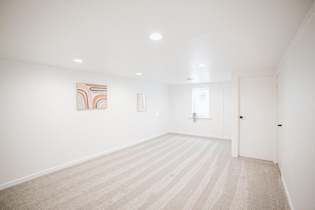 basement featuring light carpet