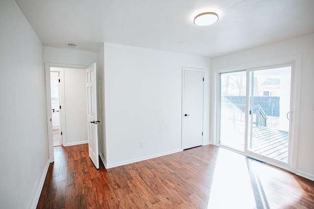 empty room featuring dark hardwood / wood-style floors