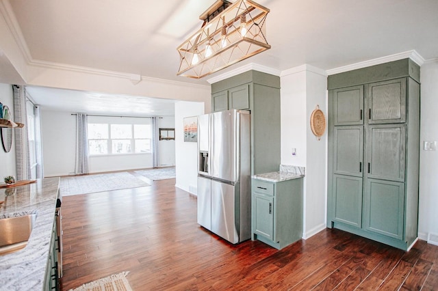 kitchen with dark hardwood / wood-style flooring, green cabinets, stainless steel fridge with ice dispenser, crown molding, and light stone countertops