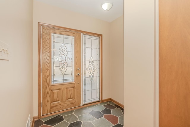 foyer with visible vents and baseboards