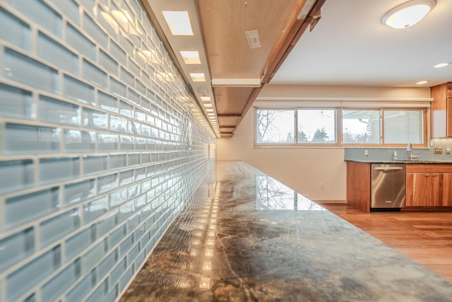 interior space with a sink and light wood-style floors