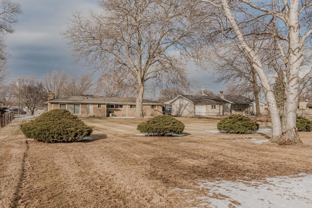 view of front of home featuring fence