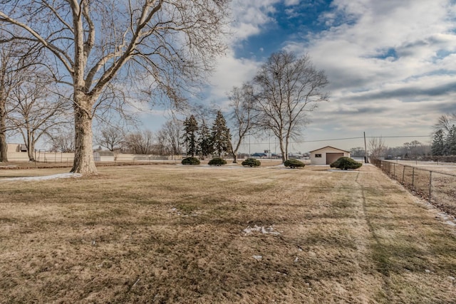 view of yard with a rural view and fence