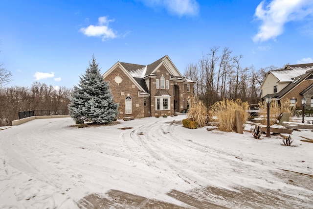 view of front of home featuring brick siding