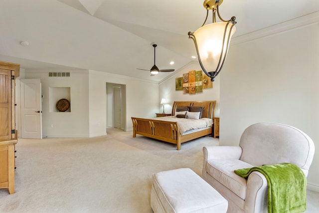 bedroom featuring lofted ceiling, crown molding, visible vents, and light colored carpet