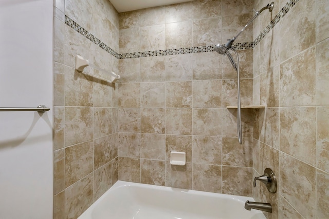 bathroom with bathing tub / shower combination