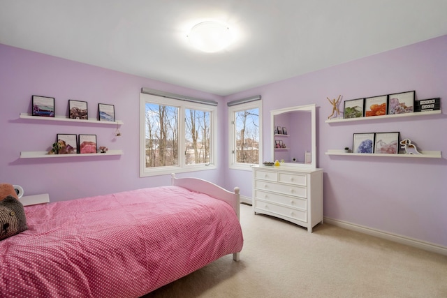 bedroom featuring carpet and baseboards