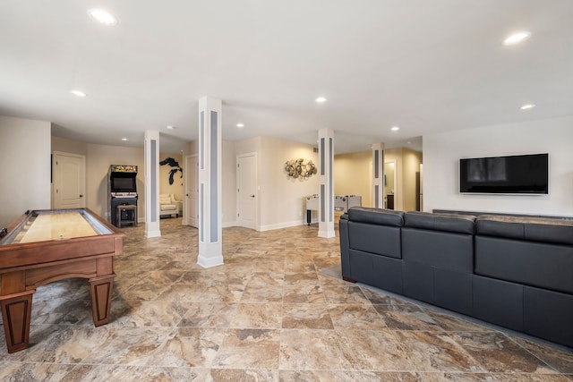 living area with baseboards and recessed lighting