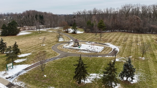 drone / aerial view featuring a forest view