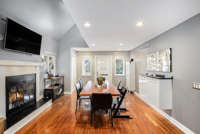 dining space featuring light wood-type flooring