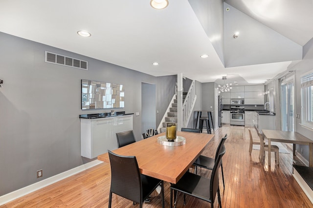 dining space featuring sink and light hardwood / wood-style flooring