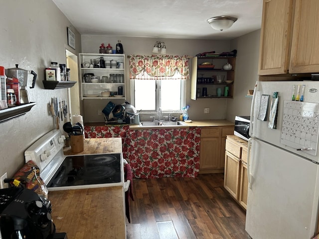 kitchen featuring range with electric stovetop, light brown cabinetry, sink, dark hardwood / wood-style flooring, and white fridge