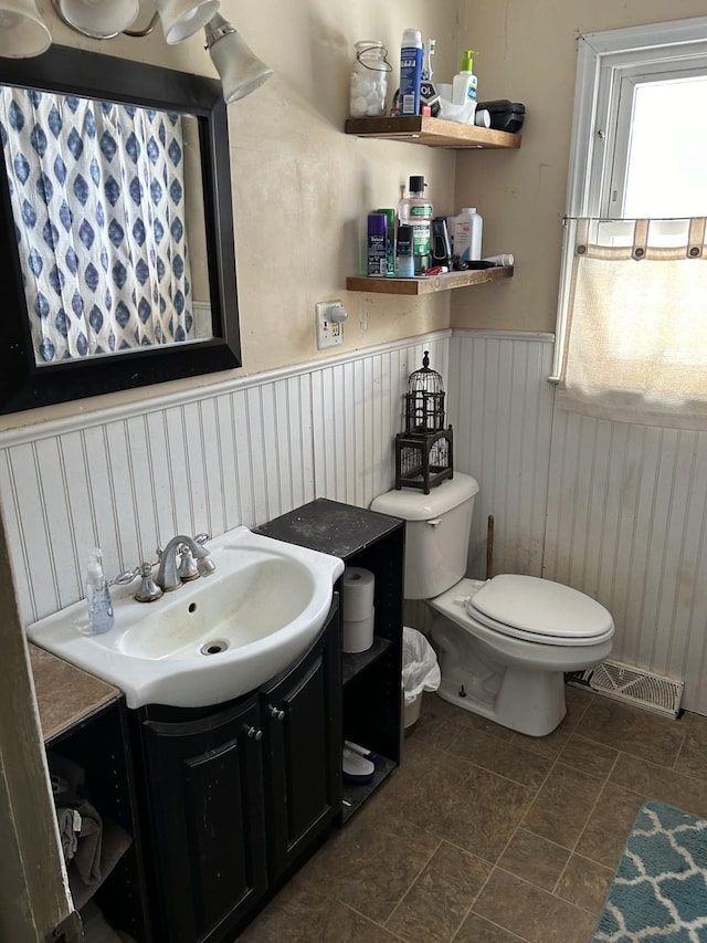 bathroom with vanity and toilet