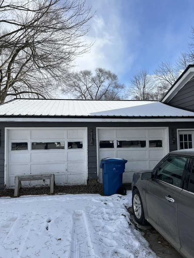 view of snow covered garage