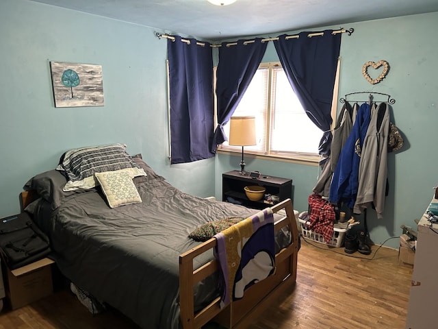 bedroom with wood-type flooring