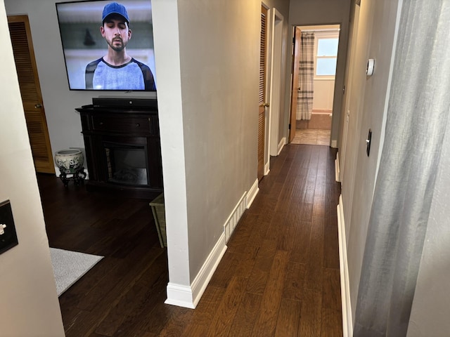 hall featuring dark wood-type flooring