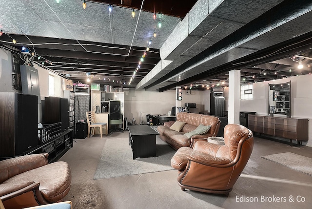 living room featuring a healthy amount of sunlight and concrete floors