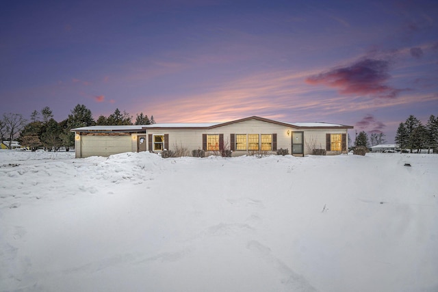 view of front of property with a garage