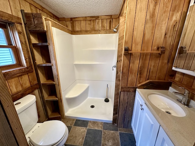 bathroom with walk in shower, a textured ceiling, and wood walls