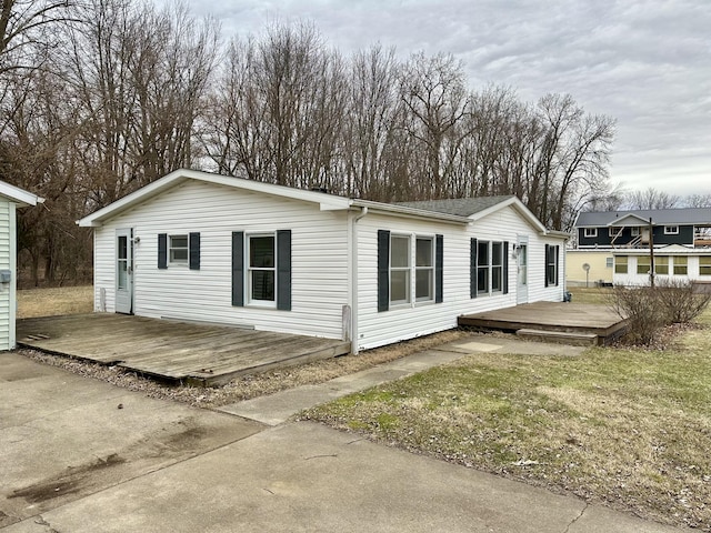 exterior space with a yard and a deck