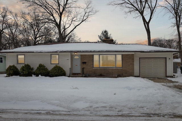 ranch-style house featuring a garage