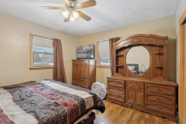 bedroom featuring light hardwood / wood-style flooring and ceiling fan