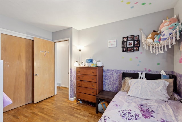 bedroom with wood-type flooring