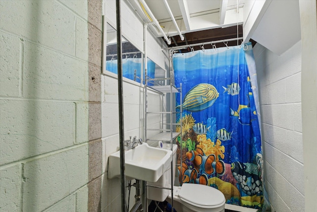 bathroom featuring walk in shower and toilet